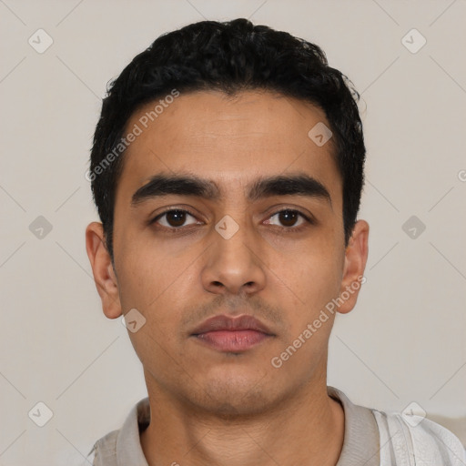 Neutral latino young-adult male with short  black hair and brown eyes