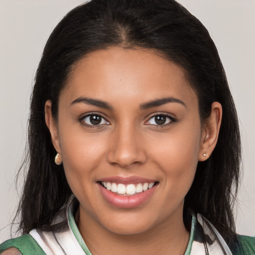 Joyful white young-adult female with long  brown hair and brown eyes