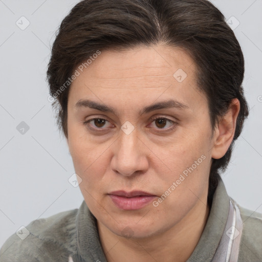 Joyful white adult female with short  brown hair and brown eyes