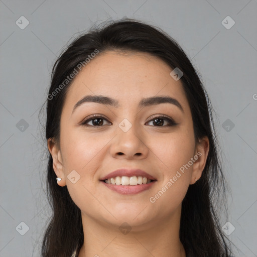 Joyful white young-adult female with long  black hair and brown eyes