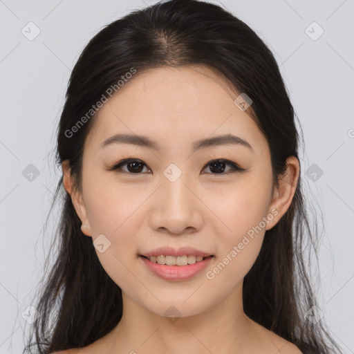 Joyful asian young-adult female with long  brown hair and brown eyes