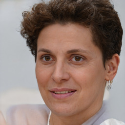 Joyful white adult female with short  brown hair and brown eyes