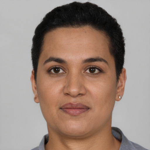 Joyful latino young-adult female with short  brown hair and brown eyes