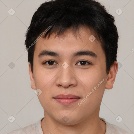 Joyful asian young-adult male with short  brown hair and brown eyes