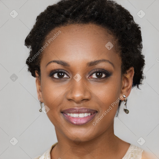 Joyful black young-adult female with short  brown hair and brown eyes