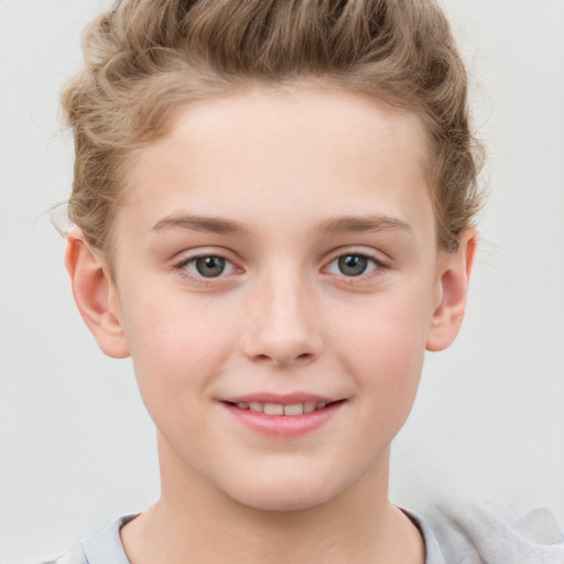 Joyful white child male with short  brown hair and grey eyes