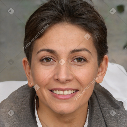 Joyful white adult female with short  brown hair and brown eyes