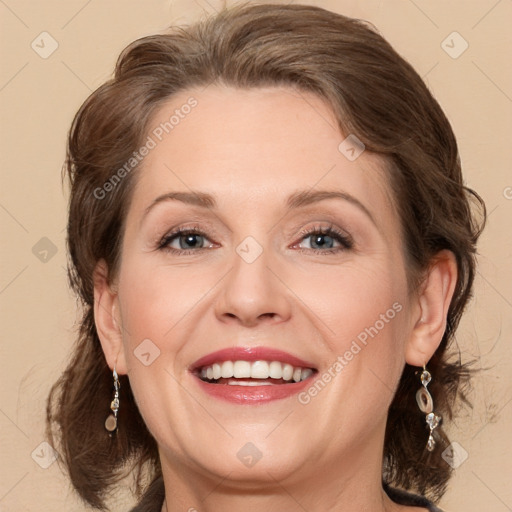 Joyful white adult female with medium  brown hair and grey eyes