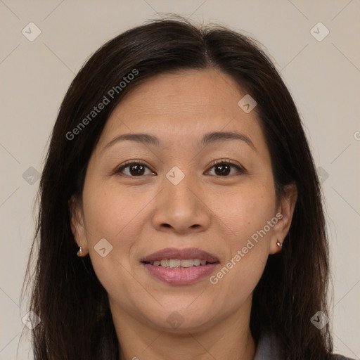 Joyful asian adult female with medium  brown hair and brown eyes