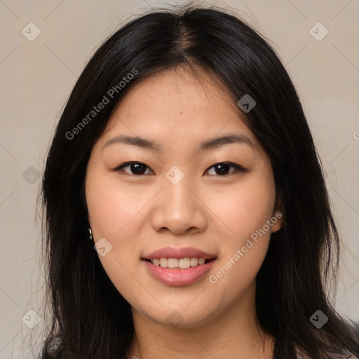 Joyful asian young-adult female with long  brown hair and brown eyes