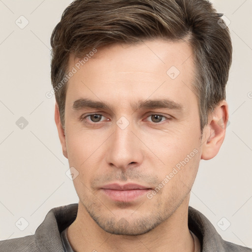 Neutral white young-adult male with short  brown hair and brown eyes