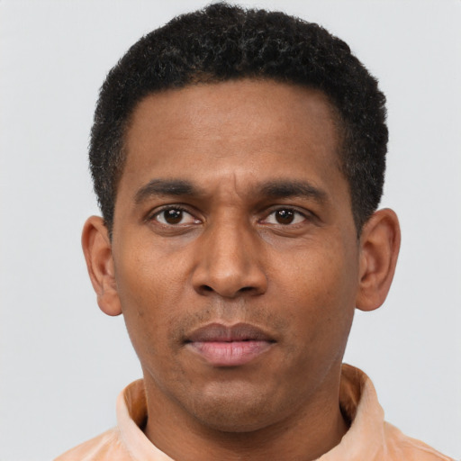 Neutral latino adult male with short  brown hair and brown eyes