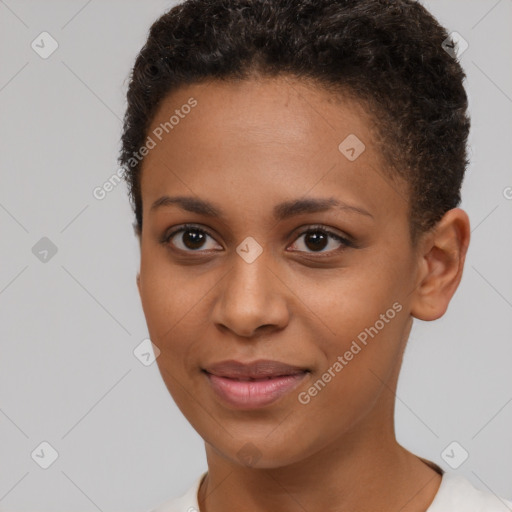 Joyful black young-adult female with short  brown hair and brown eyes