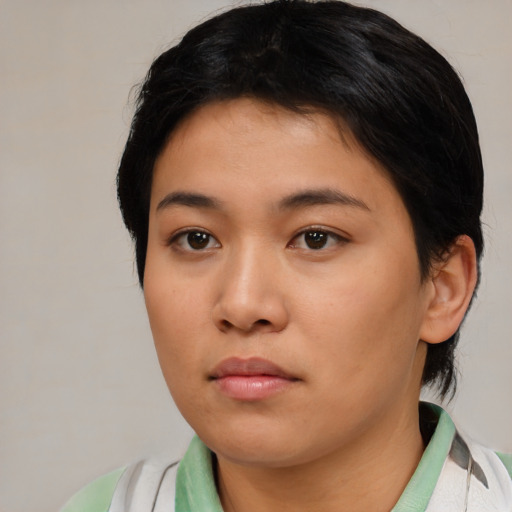 Neutral asian young-adult female with medium  brown hair and brown eyes