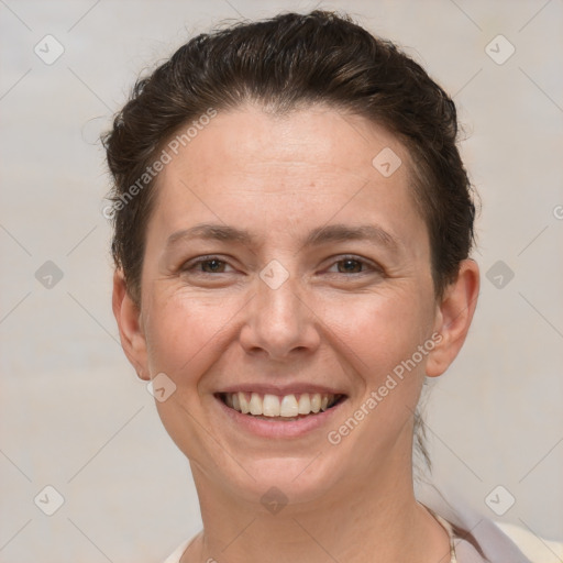 Joyful white adult female with short  brown hair and brown eyes