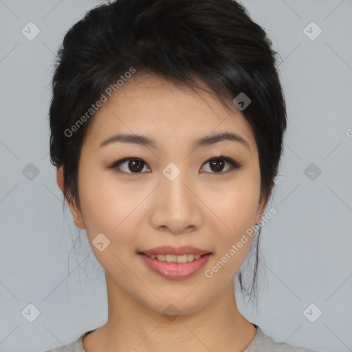 Joyful asian young-adult female with medium  black hair and brown eyes