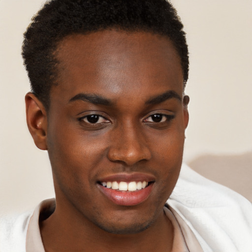 Joyful black young-adult male with short  brown hair and brown eyes