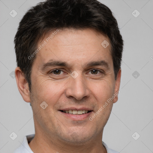 Joyful white adult male with short  brown hair and brown eyes