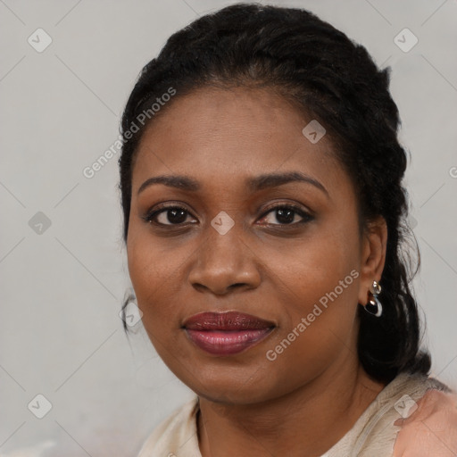 Joyful black young-adult female with medium  black hair and brown eyes