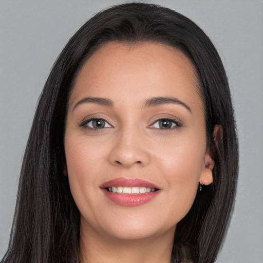 Joyful white young-adult female with long  black hair and brown eyes