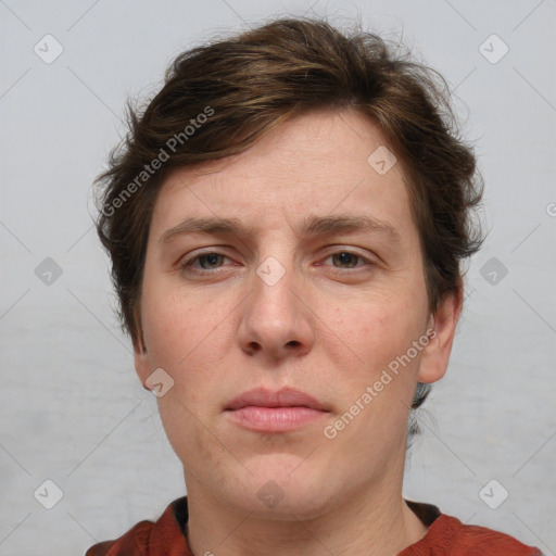 Joyful white adult female with short  brown hair and grey eyes