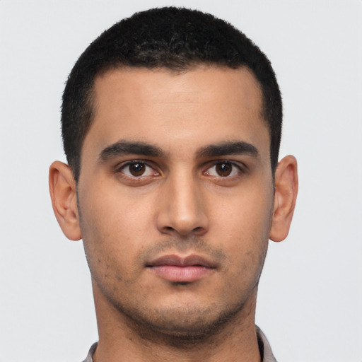 Neutral latino young-adult male with short  black hair and brown eyes