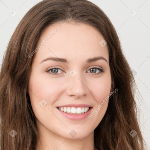 Joyful white young-adult female with long  brown hair and green eyes