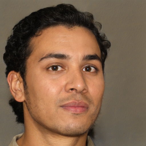 Neutral latino young-adult male with short  brown hair and brown eyes