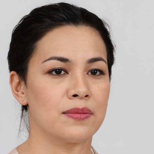 Joyful white young-adult female with short  black hair and brown eyes