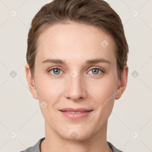 Joyful white young-adult female with short  brown hair and grey eyes