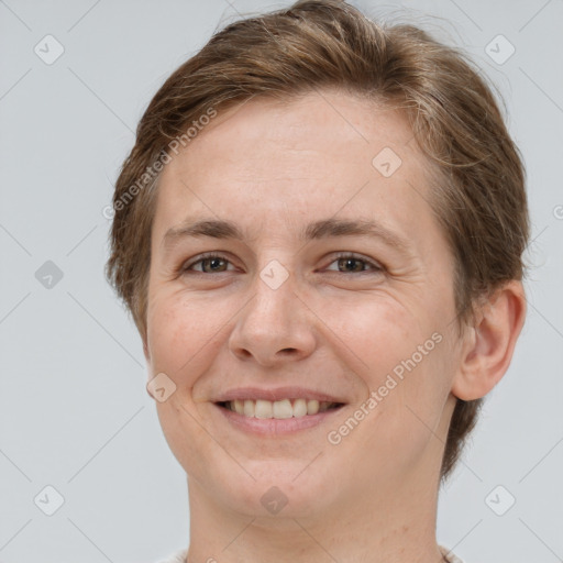 Joyful white adult female with short  brown hair and grey eyes