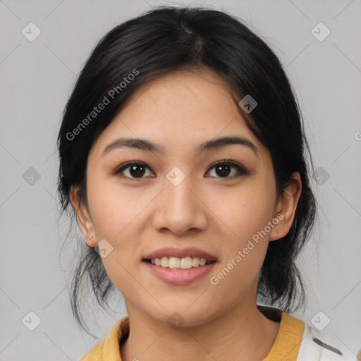 Joyful asian young-adult female with medium  black hair and brown eyes