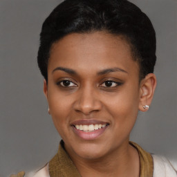 Joyful black young-adult female with short  black hair and brown eyes