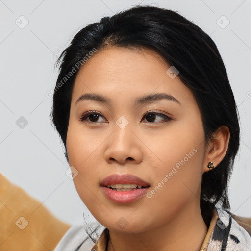 Joyful asian young-adult female with medium  black hair and brown eyes