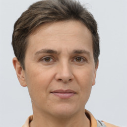 Joyful white adult female with short  brown hair and brown eyes