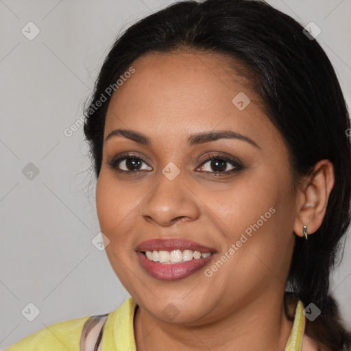 Joyful latino young-adult female with long  brown hair and brown eyes