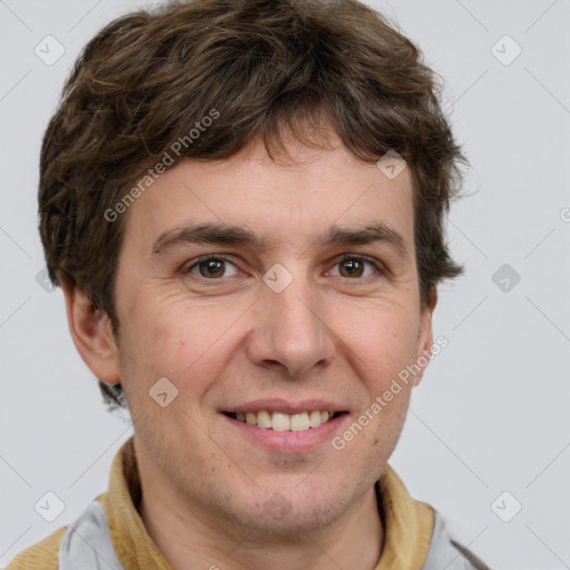 Joyful white adult male with short  brown hair and grey eyes