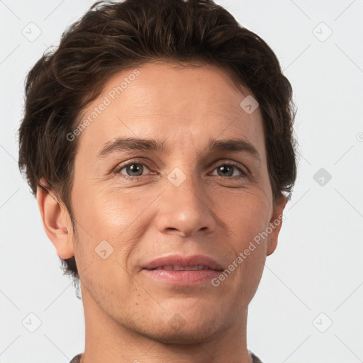 Joyful white adult male with short  brown hair and grey eyes