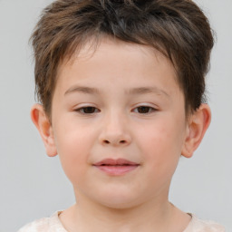 Joyful white child male with short  brown hair and brown eyes