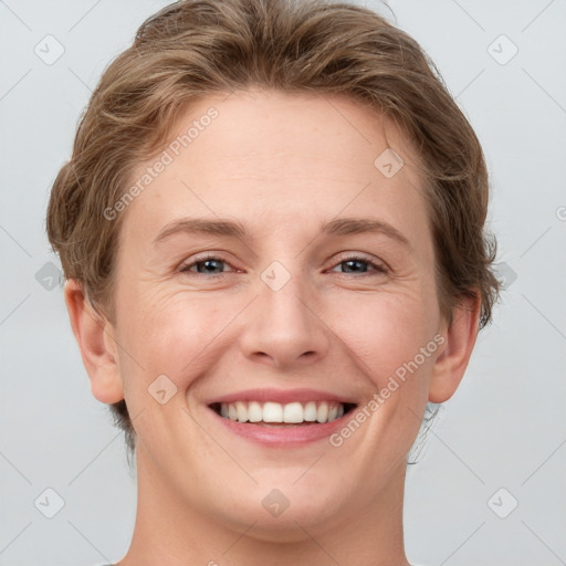 Joyful white adult female with short  brown hair and brown eyes