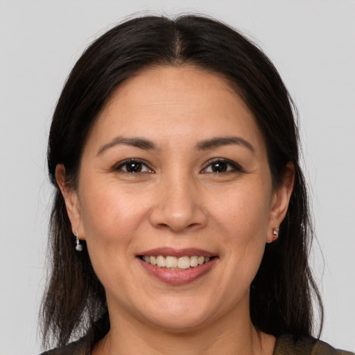 Joyful white adult female with medium  brown hair and brown eyes