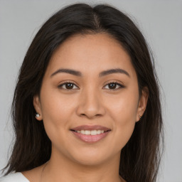 Joyful white young-adult female with medium  brown hair and brown eyes