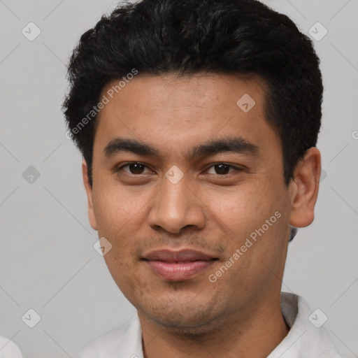 Joyful latino young-adult male with short  black hair and brown eyes