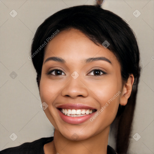 Joyful latino young-adult female with long  black hair and brown eyes