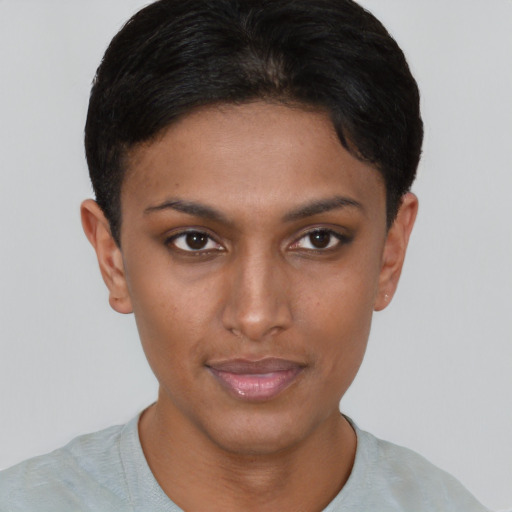 Joyful black young-adult female with short  brown hair and brown eyes