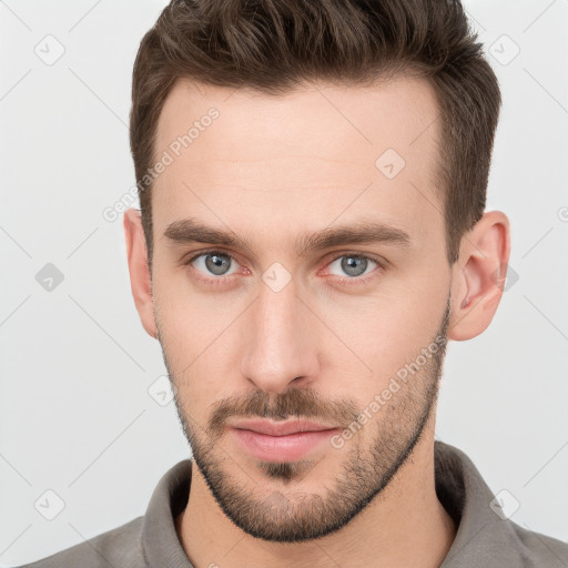 Neutral white young-adult male with short  brown hair and brown eyes