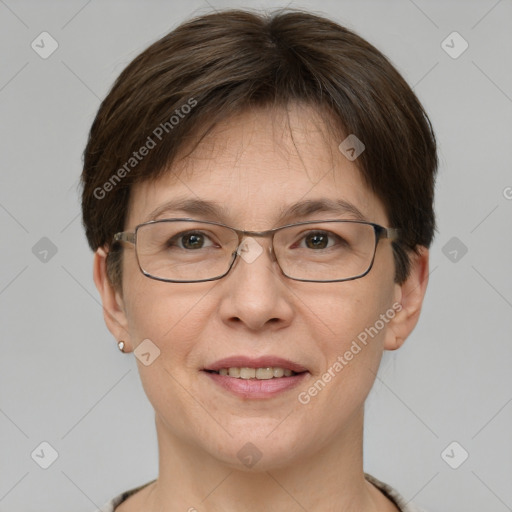 Joyful white adult female with short  brown hair and grey eyes