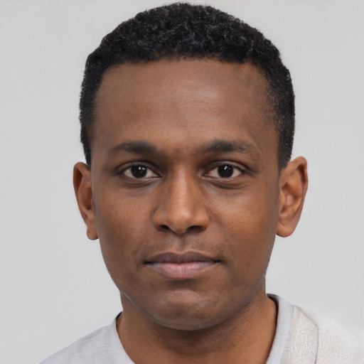 Neutral black young-adult male with short  black hair and brown eyes