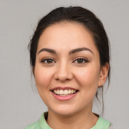 Joyful white young-adult female with medium  brown hair and brown eyes