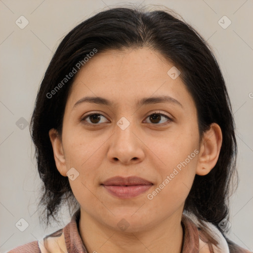 Joyful latino young-adult female with medium  brown hair and brown eyes